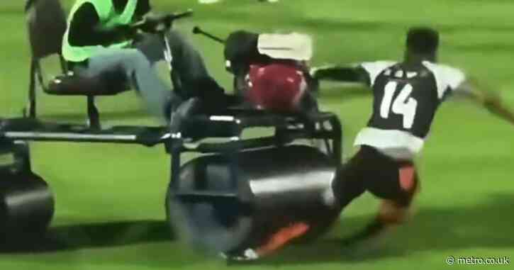 Horrifying moment Andros Townsend is run over by pitch roller before Thai football match