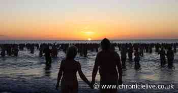 Hundreds of swimmers strip off and brave North Sea for UK's largest skinny dip in Northumberland