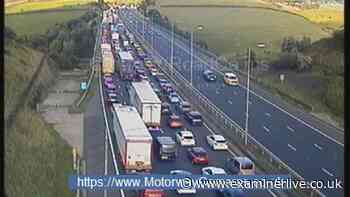Woman 'on wrong side of railings' seriously injured in fall from M62 bridge