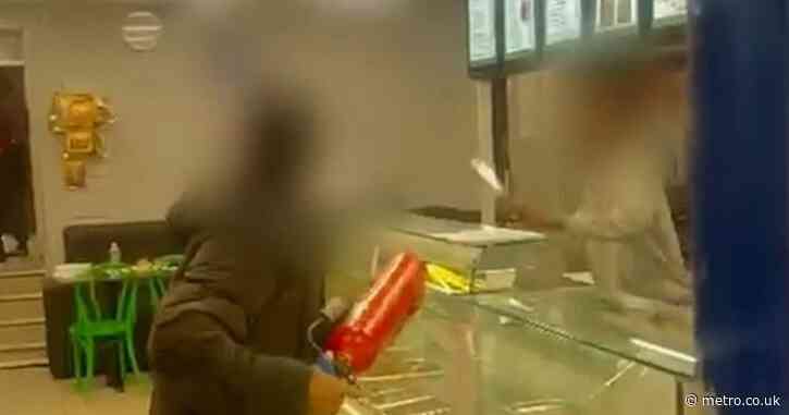Fearless bystander takes on knifeman terrorising takeaway with fire extinguisher