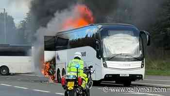 Celtic supporters bus bursts into FLAMES: Emergency services rush to scene in Glasgow to evacuate fans after Old Firm derby