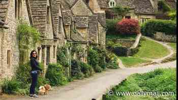 Controversial homeowners on England's prettiest street are forced into demolition works after claims they were turning historic cottage into 'monstrosity'