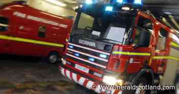 Road closed as fire crews tackle building blaze in Glasgow