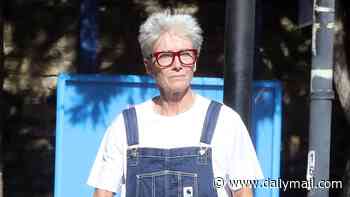 Emma Thompson, 67, keeps comfortable in dungarees as she makes a rare appearance with husband of 23 years Greg Wise