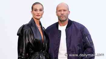 Rosie Huntington-Whiteley wows in a sexy leather trench coat as she poses with her fiancé Jason Statham at London Fashion Week's star-studded Burberry show