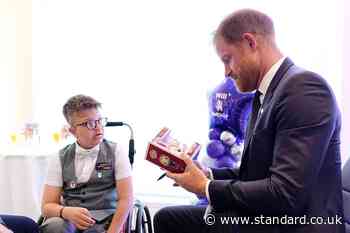 All dolled up: Harry presented with mini version of himself