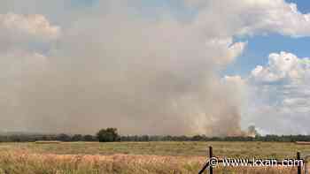 Authorities responding to 'large grass fire' in Mustang Ridge area