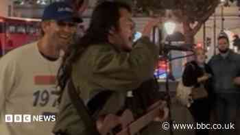 Exeter Coldplay star Martin joins busker for duet