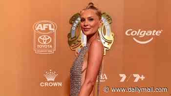 AFL WAG Tayla Brown risks a wardrobe malfunction as she goes braless at Brownlow