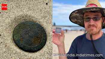 Metal detectorist stumbles on a 140-year-old Zanzibar coin while beachcombing in Australia