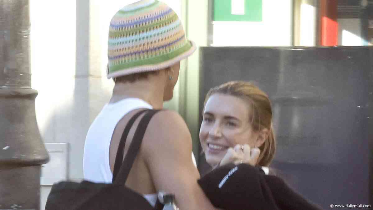 Strictly's Dani Dyer and her professional dance partner Nikita Kuzmin embrace as they leave intense rehearsals together