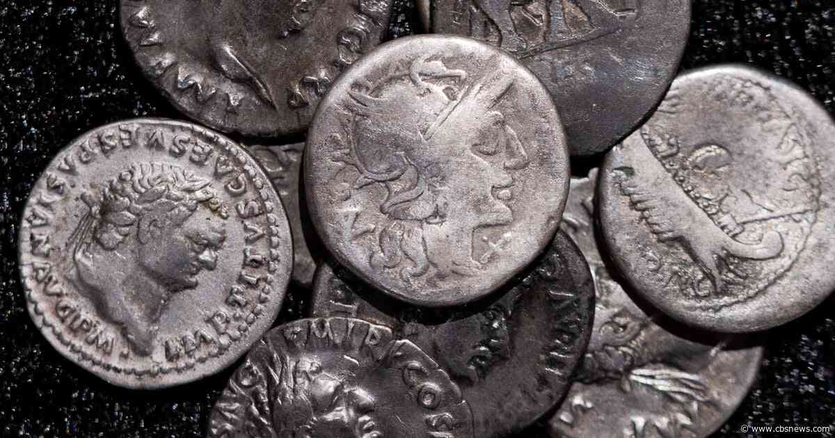 Metal detectorist finds record-breaking trove of ancient Roman coins