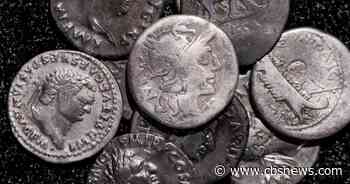 Metal detectorist finds record-breaking trove of ancient Roman coins