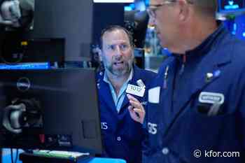 Wall Street holds near its record after Brent oil briefly falls below $98 per barrel