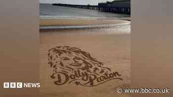 Artist returns to beach to create sand portraits