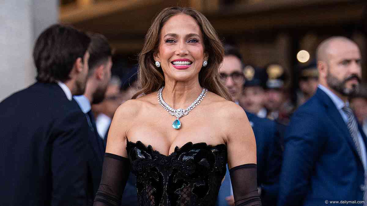 Jennifer Lopez channels old Hollywood glamour in a low-cut strapless black gown at the star-studded Vogue World event in Milan