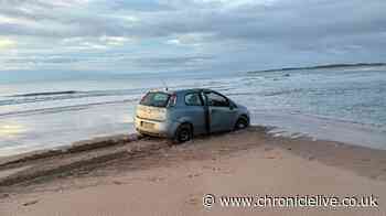 Anger as abandoned car remains on Northumberland beach after four days