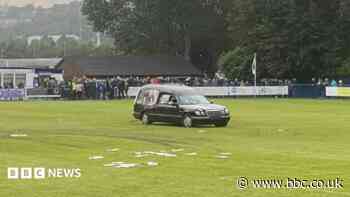Five charged over football pitch hearse disorder