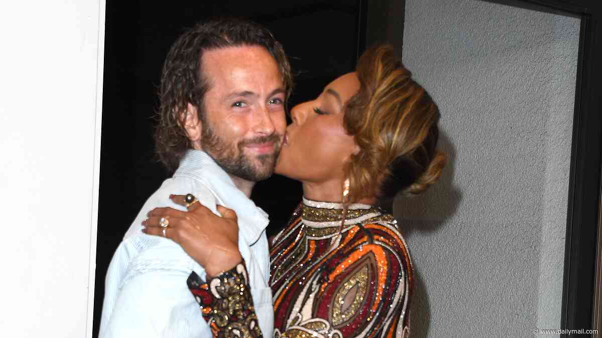 Mel B, 51, plants a kiss on husband Rory McPhee, 38, as she enjoys some backstage PDA at America's Got Talent final