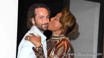 Mel B, 51, plants a kiss on husband Rory McPhee, 38, as she enjoys some backstage PDA at America's Got Talent final