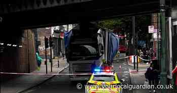 LIVE updates as lorry strikes bridge causing south London high street to close