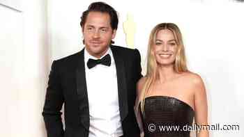 Margot Robbie drops her maiden name and starts using her British husband's surname a decade after tying the knot