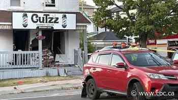 1 dead, 1 hospitalized after SUV backs into barber shop