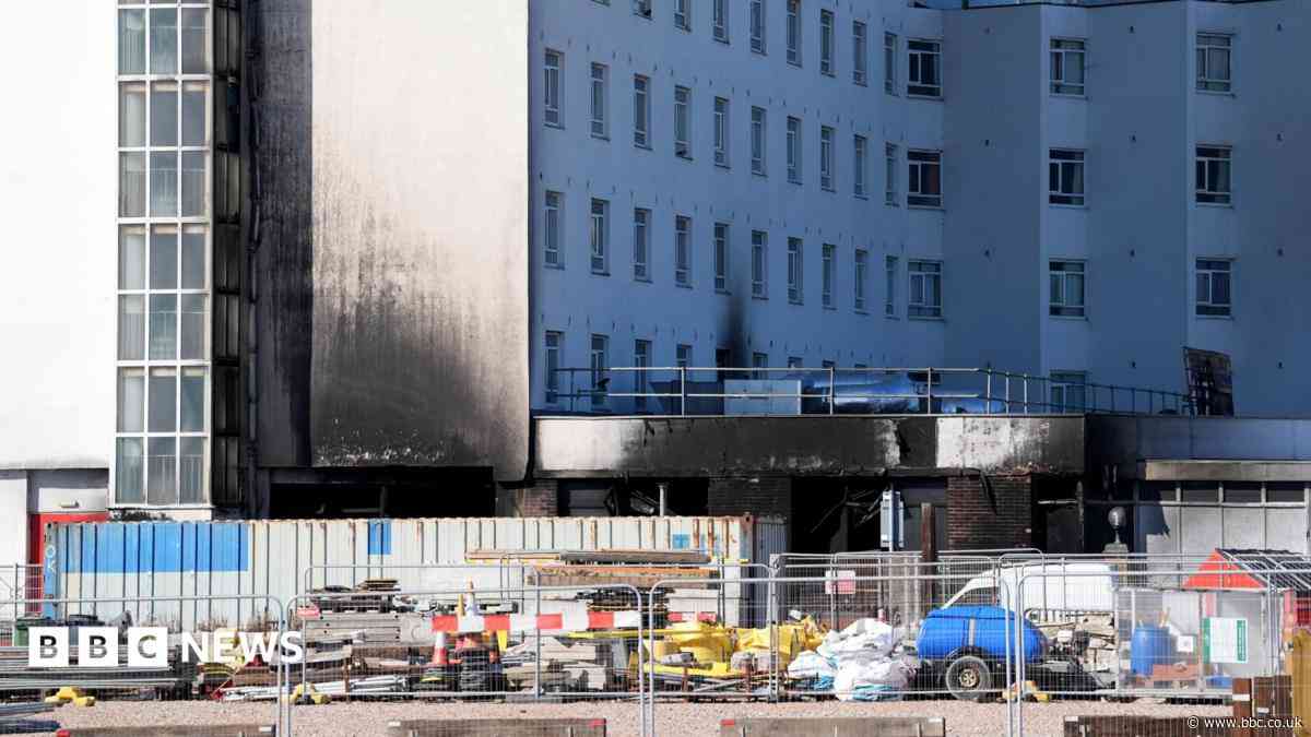 Fire crews back at burnt hotel after smoke report