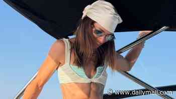 Danica Patrick shows off her ripped physique in tiny bikini as she soaks up the sun after Aaron Rodgers 'intimacy' feud