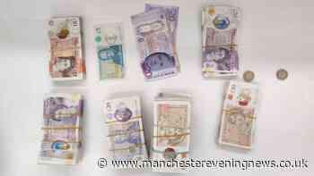 Thousands of pounds seized and four arrested in Manchester city centre raids