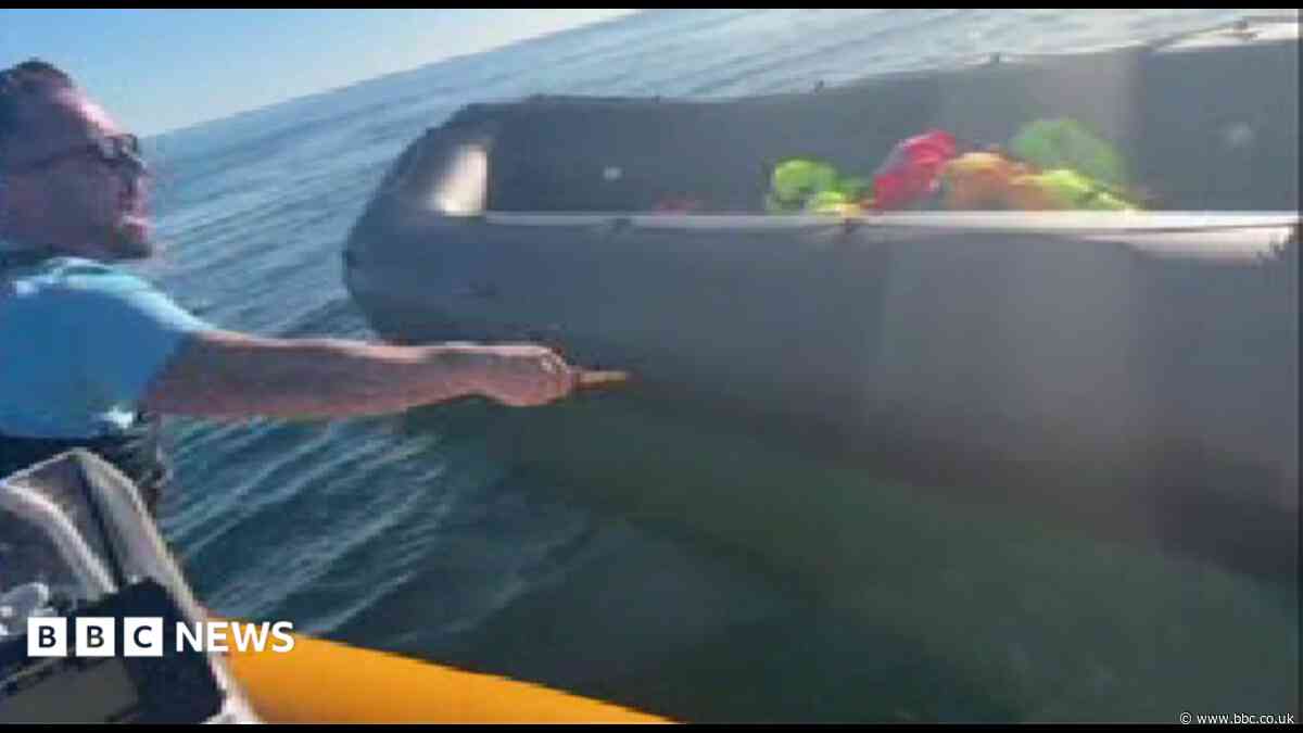 Police examine video of anti-migrant activist slashing dinghy with knife