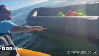 Police examine video of anti-migrant activist slashing dinghy with knife