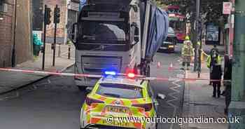 Lorry strikes bridge causing south London high street to close