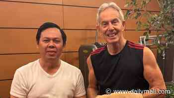 Tony Blair commits to new arms race: Former Prime Minister, 73, shows off buff physique as he hits the gym in Indonesia