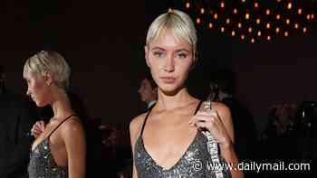 Iris Law turns up the glamour in a silver sequin midi dress as she joins chic Rachel Zegler at Milan Fashion Week's Fendi show