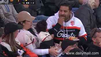 Male baseball fan is savaged by social media after making his wife hold their baby AND get the food at Giants game: 'Immediate divorce'