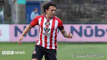 Footballer faces court over driving offences