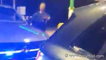 Danny Tommo is arrested at a petrol station for criminal damage after filming himself slashing Channel dinghy with rescuer on board