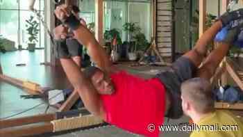 Anthony Joshua's torture training! Boxer uses ancient Cossack warriors' stretching machine to prepare himself to fight Tyson Fury in a painful-looking workout routine