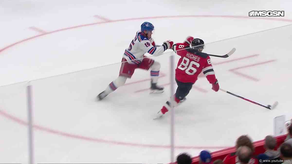 Jack Hughes scores a goal against the New Jersey Devils
