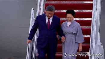 Xi Jinping is hit with fresh online health rumours as video shows him 'forcibly grabbing' wife's hand while exiting plane - days after skipping banquet in India