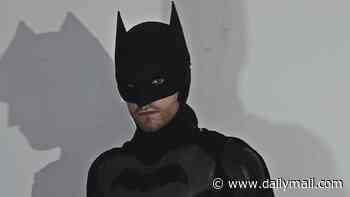 Holy handbags! Partygoer dressed as Batman saves the day when he catches bag snatcher in the street