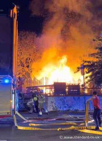 Watch: Fire tears through community garden in east London