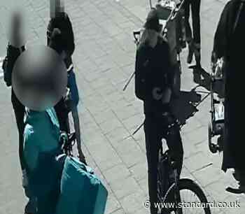 Moment undercover police pounce on wanted man while disguised as street cleaner and Deliveroo rider