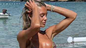 Love Island's Molly Smith displays her six-pack abs in a patterned bikini as she cuddles up to co-star husband Tom Clare on Turkish mini-moon