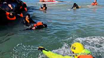 Moment young boy is plucked out of the English Channel during small boat rescue