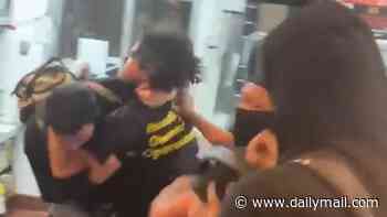Feral teens who leaped over McDonald's counter to attack staff are charged with HATE crime
