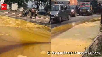 Truck carrying desi ghee overturns in UP, locals rush to collect what spilled on the road