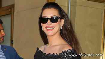 Anne Hathaway, 43, reveals her bump as she steps out in New York after missing Verity premiere in London due to being in her third trimester