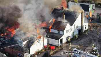 Centuries-old Grade II-listed pub where Pepys and Defoe drank burns down in 'heartbreaking' fire as man in his 20s is arrested for arson